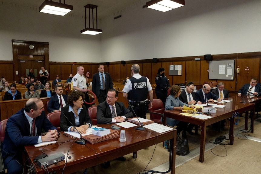 Lawyers gather inside a Manhattan criminal court.