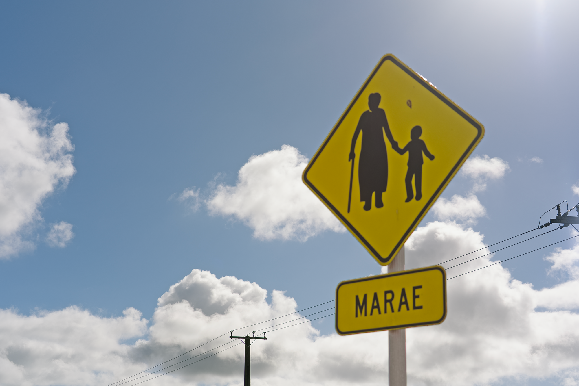 A sign near a crossing.