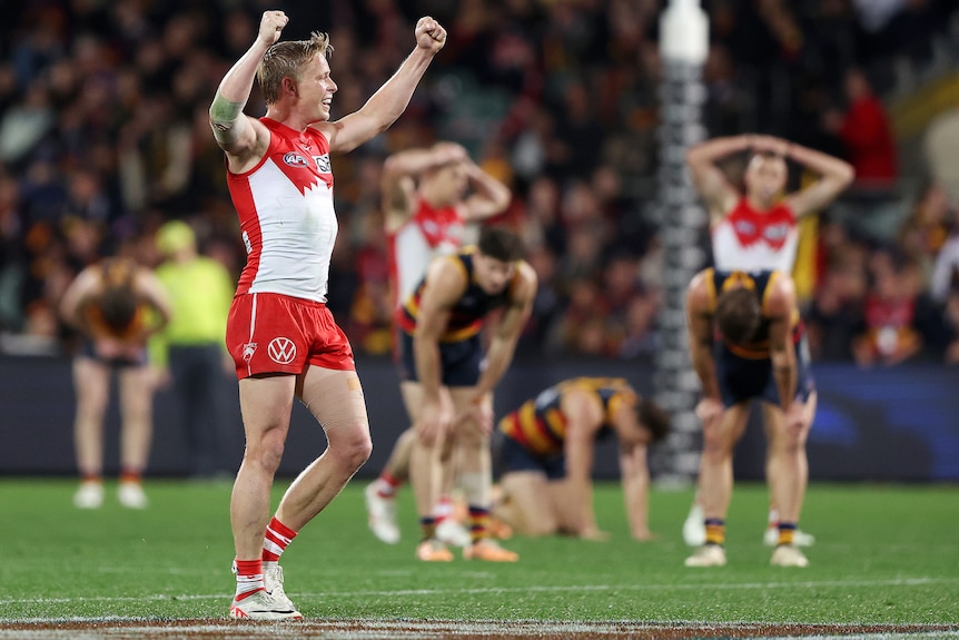A Sydney Swans AFL player celebrates his side's victory over the Adelaide Crows.