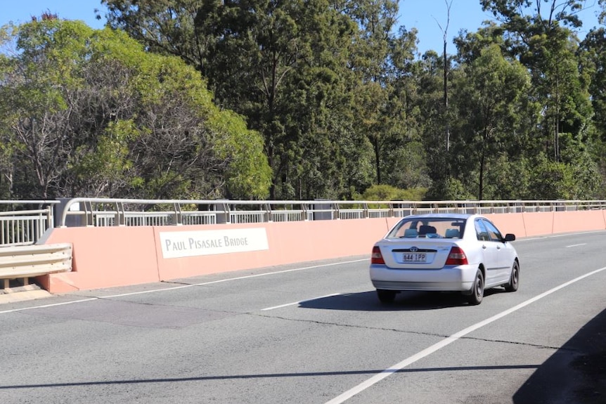 A car drives on Paul Pisasale Bridge, Sinnathamby Boulevard, Springfield Central, west of Brisbane.