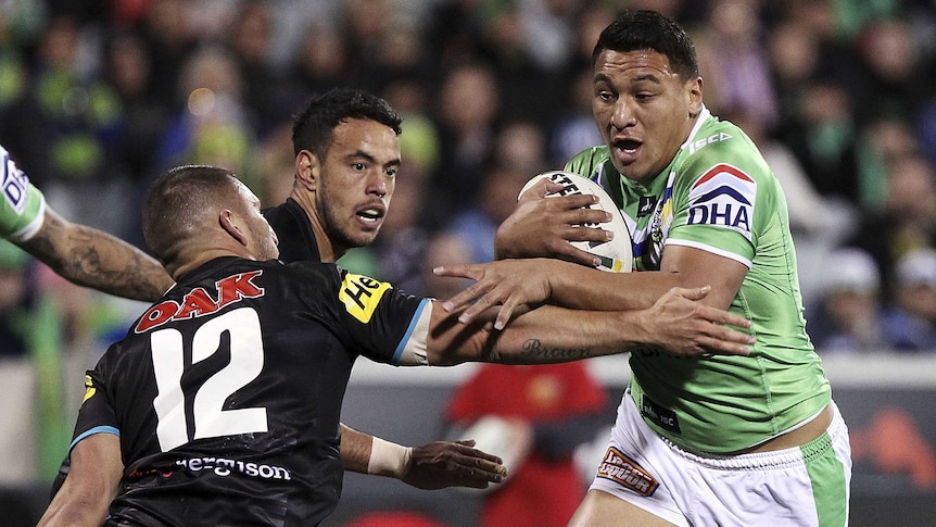 On the burst ... Josh Papalii meets the Panthers defence