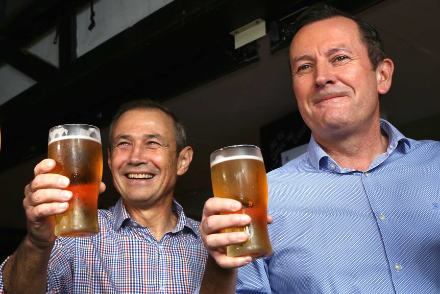 Roger Cook and Mark McGowan drink pints of beer in the Swinging Pig pub in Rockingham.