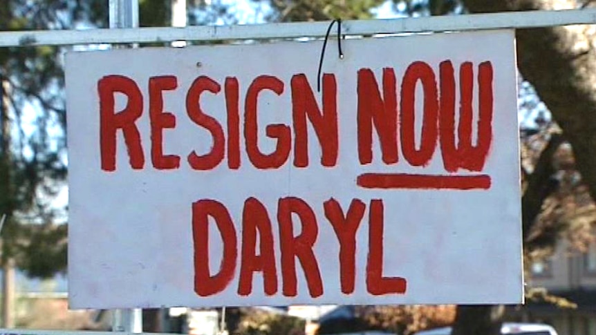 A sign reading resign now Daryl