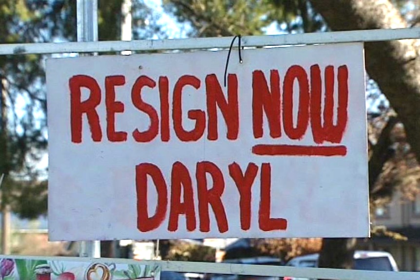 A sign reading resign now Daryl