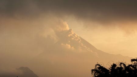 Red alert: people headed for evacuation shelters after the Mt Merapi alert level was raised [file photo]