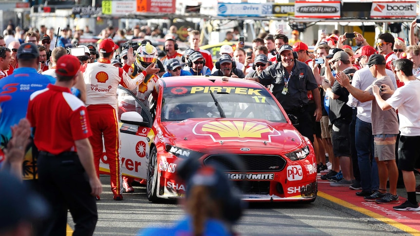 Scott McLaughlin pushes his car back to the pit on the victory lap of the Gold Coast 600.