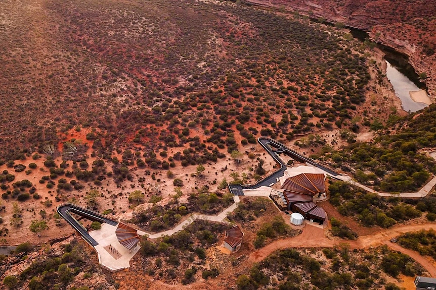 High drone shot of two Skywalk platforms above river and gorge