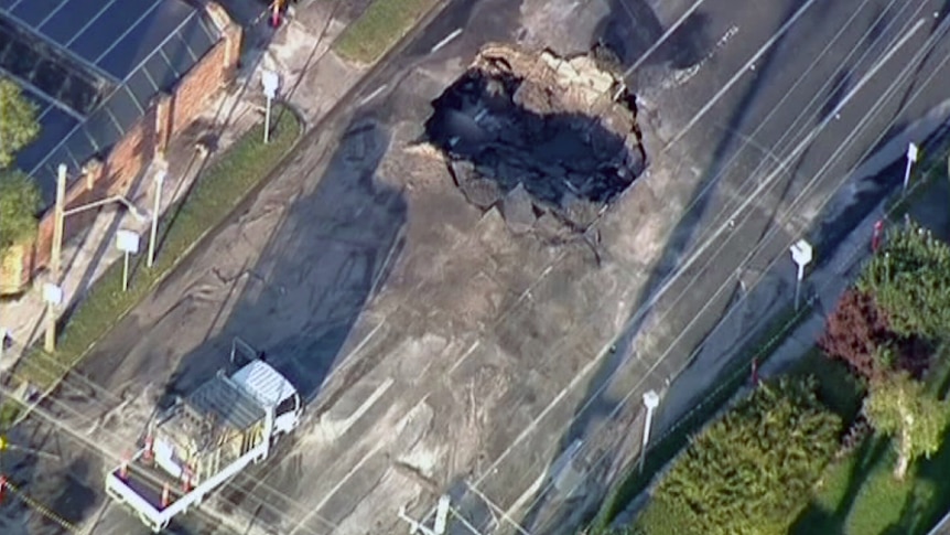 A road has been closed in Melbourne's south-east after a hole made three lanes collapse.