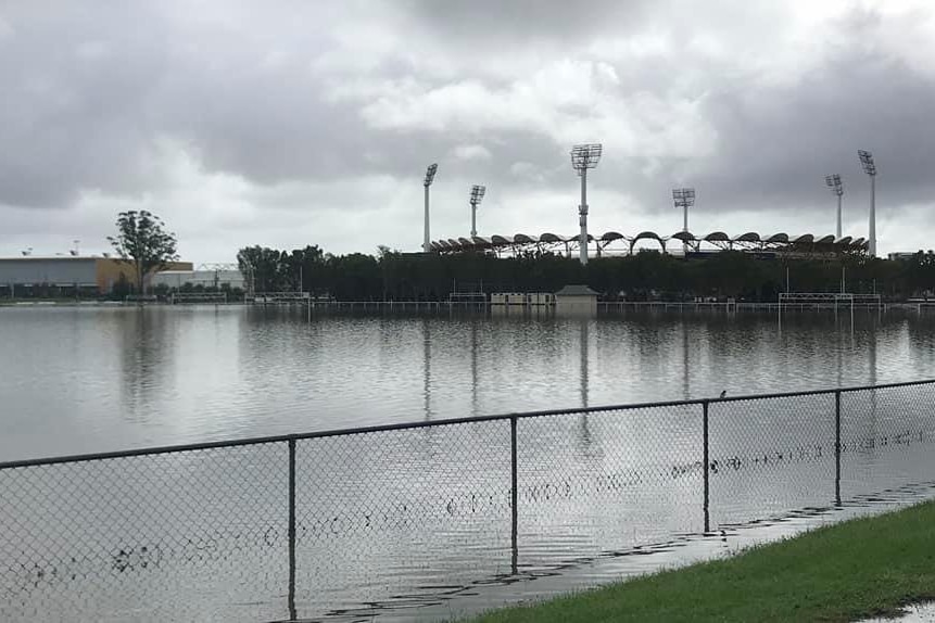 Flood water covers the grounds in front of the stadium