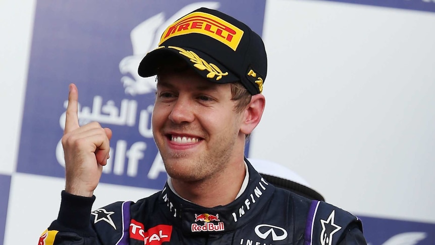 Number one ... Sebastian Vettel celebrates on the podium