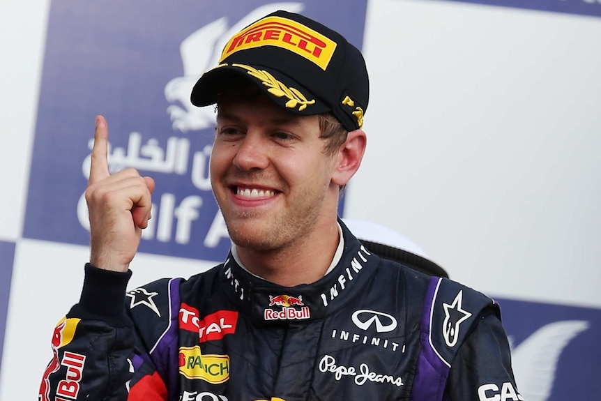 Vettel shows his delight on the podium