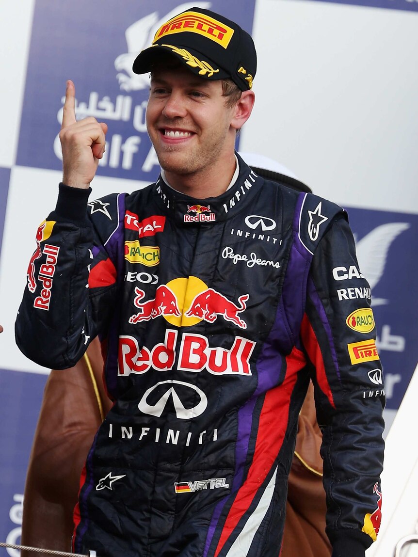 Number one ... Sebastian Vettel celebrates on the podium