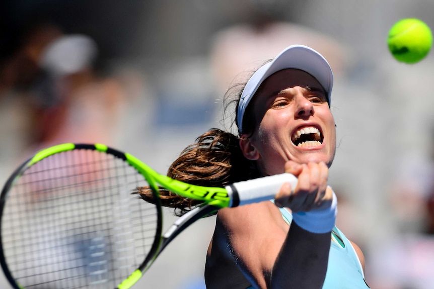 A close-up image of Johanna Konta hitting a forehand with the ball in frame.
