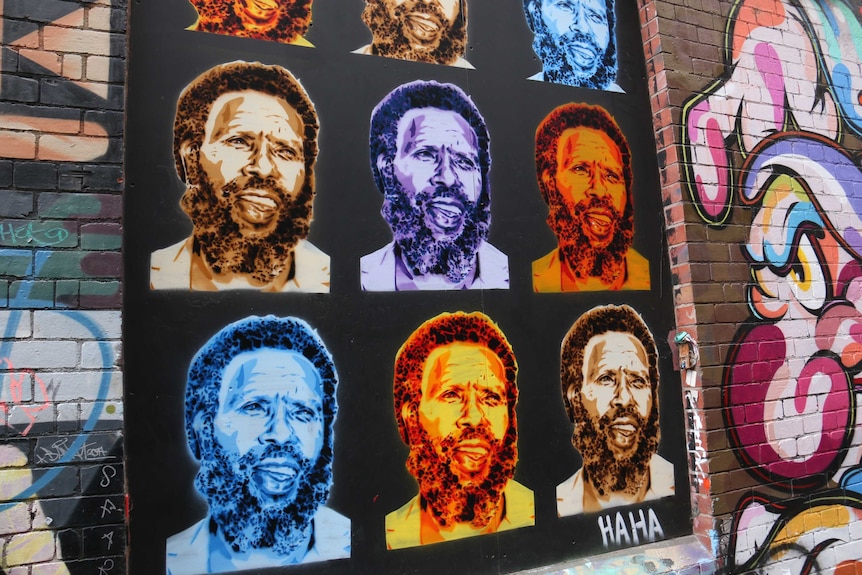 Colourful street art featuring Indigenous rights activist Eddie Mabo.