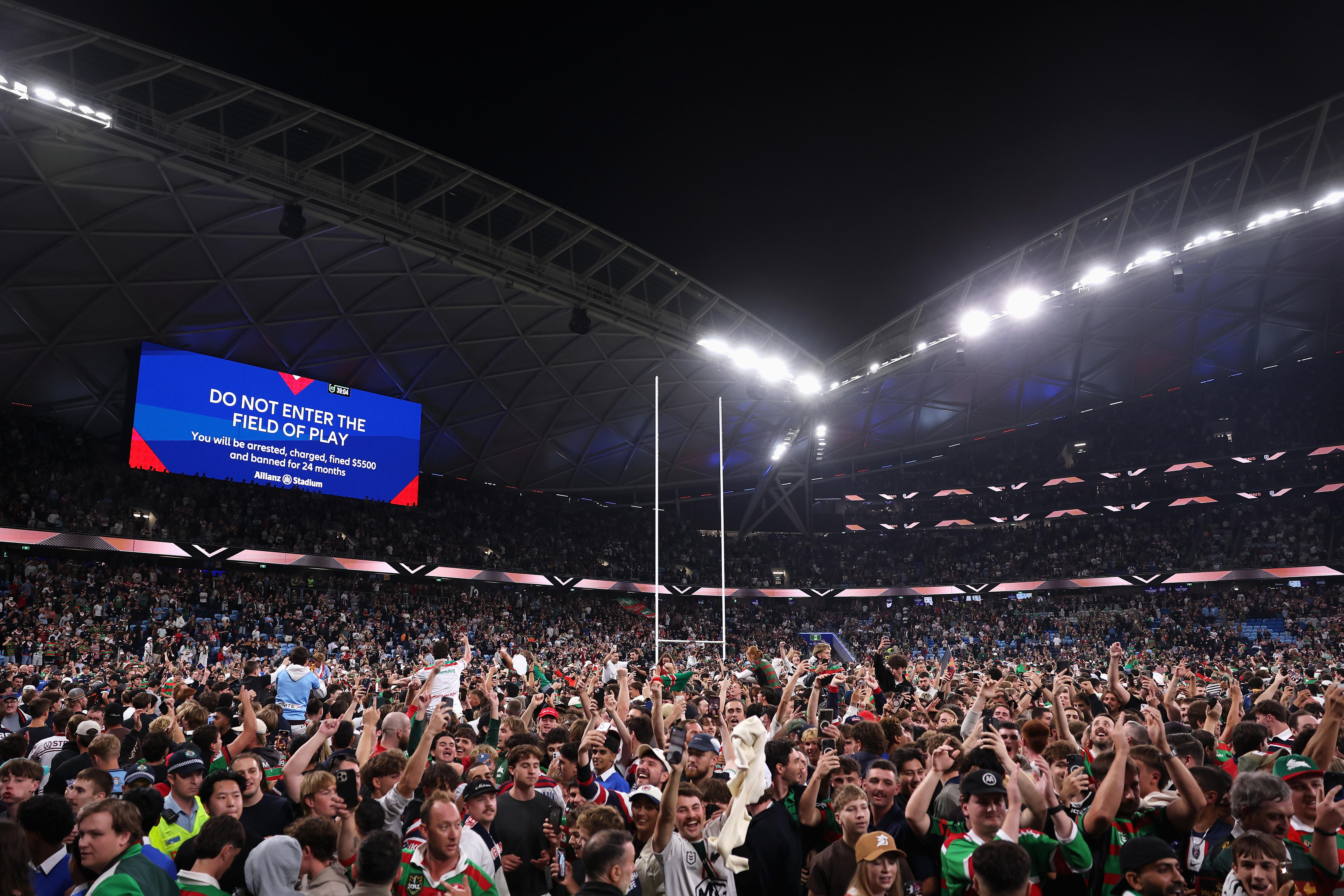 Fans on the field at the Sydney Football Stadium after Alex Johnston's record-breaking try.