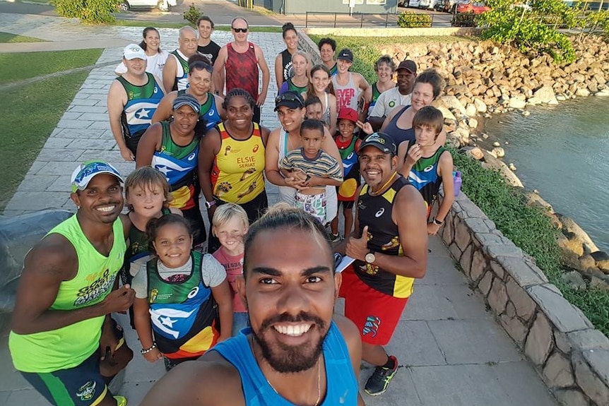 Saliman Bin Juda takes a selfie style photograph with other members of the TI Deadly Runners group.