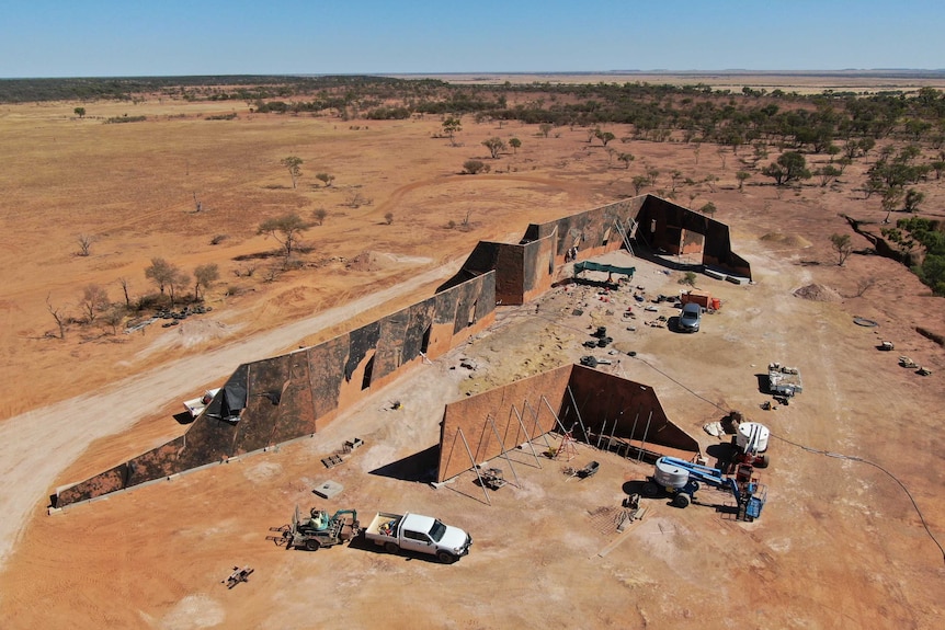 Work continues at the Winton Age of Dinosaurs museum on a new building and moving a giant dinosaur walk fossil