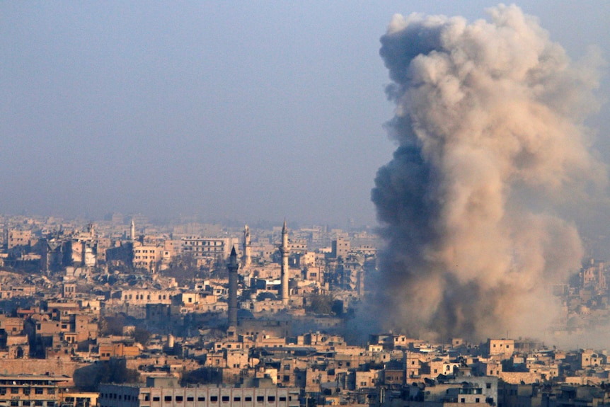 A huge cloud of smoke rises from a government-held area of Aleppo.
