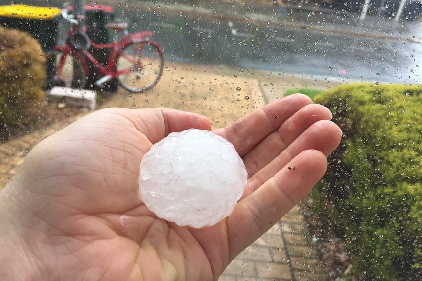 Big hail stone in someone's hand
