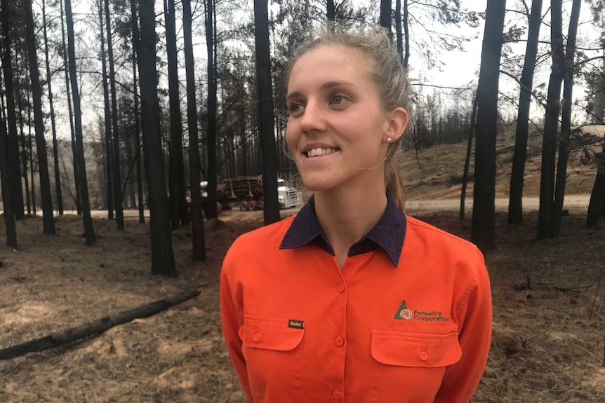 Forestry Corporation harvesting supervisor, Elle Kromar, wearing an orange shirt