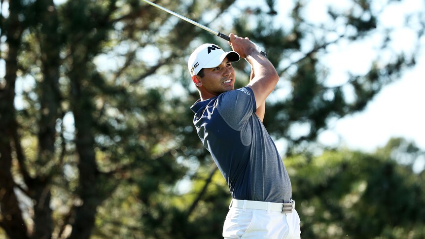 Jason Day plays a shot in Illinois