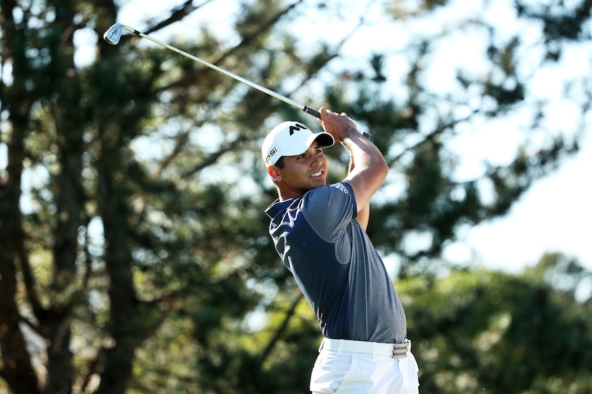 Jason Day plays a shot in Illinois