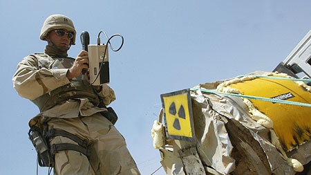Radiation expert examines uranium mixing vat in Iraq