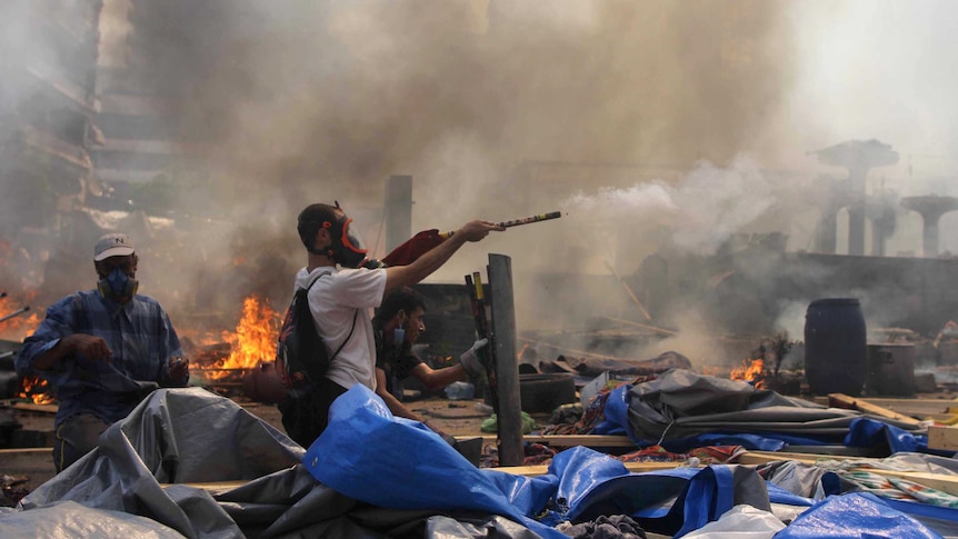 Supporter of the Muslim Brotherhood fires fireworks towards police