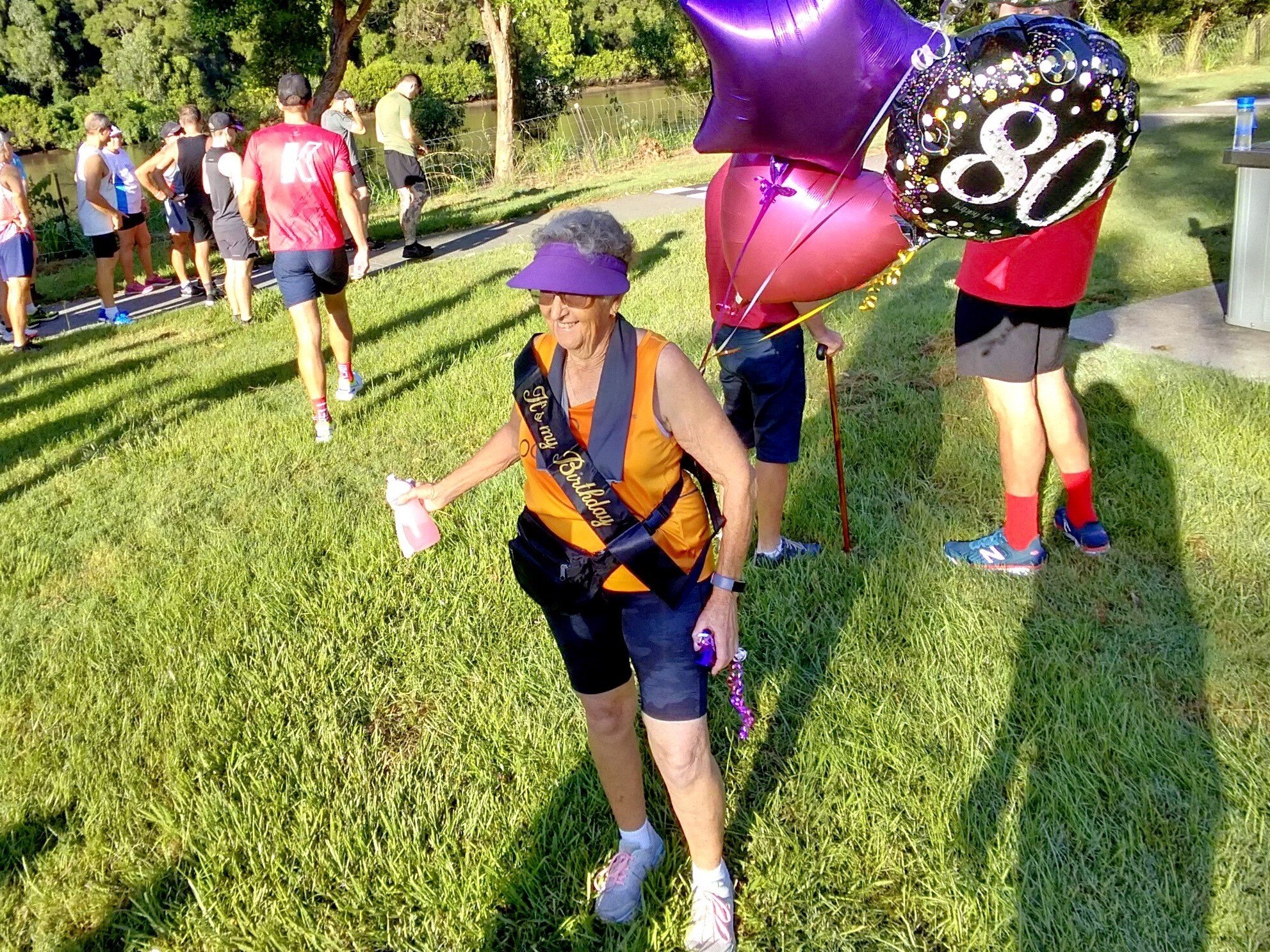 Lenore Rutley with 80th-birthday balloons.
