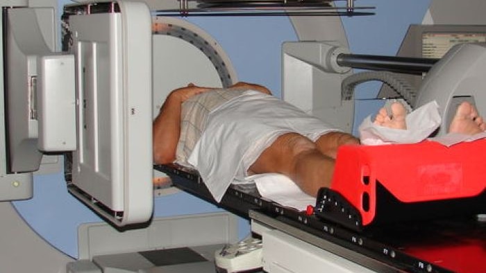 A man undergoes radiation treatment.
