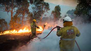 Avon Valley bushfire and firemen with hose