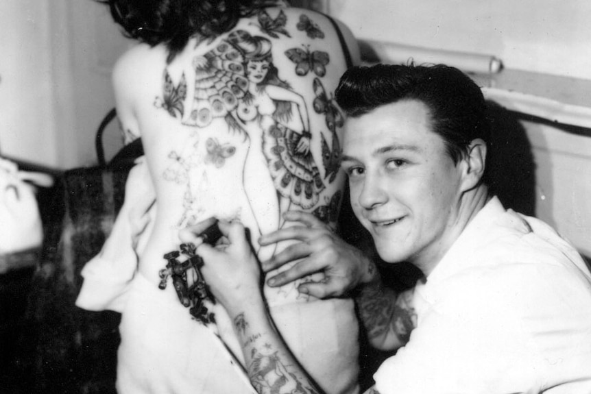 Tattoo artist Les Bowen tattooing Cindy Ray in the 1960's.