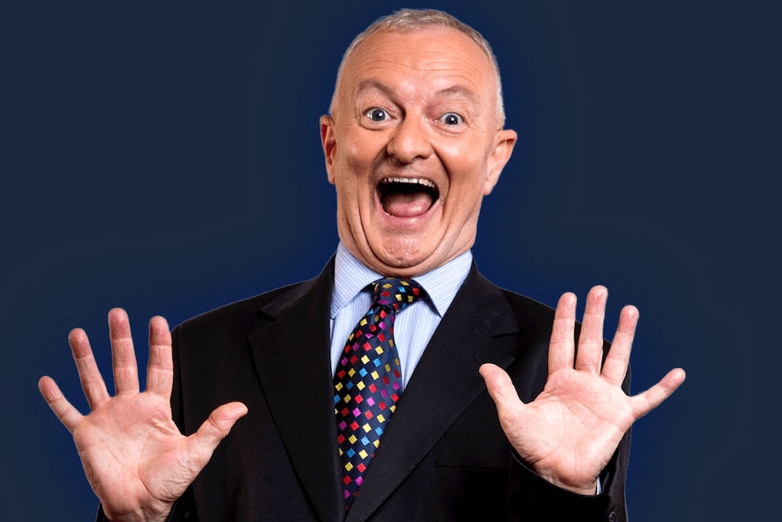 Antony Green smiles and holds up his hands.
