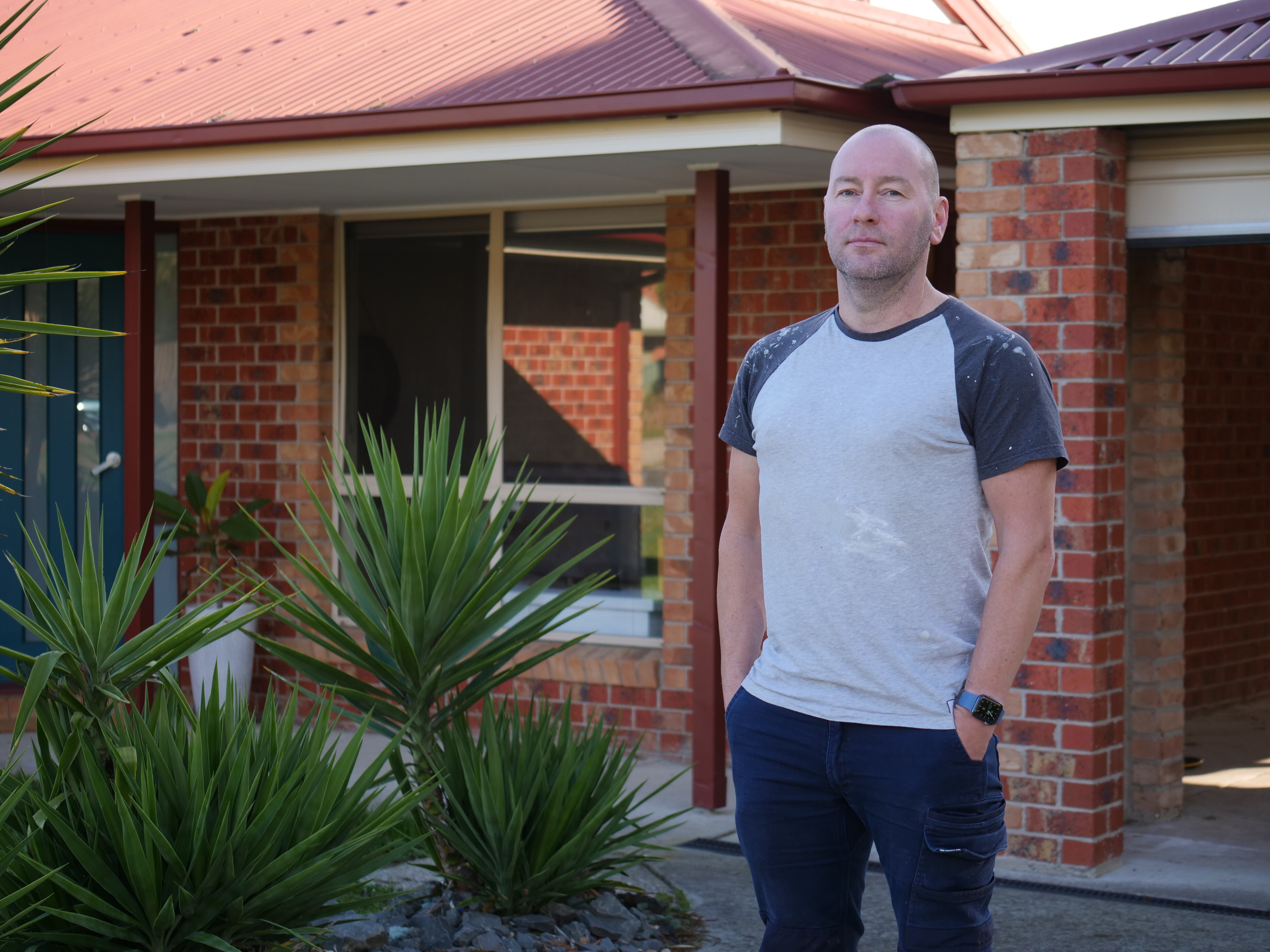 A man outside a house.
