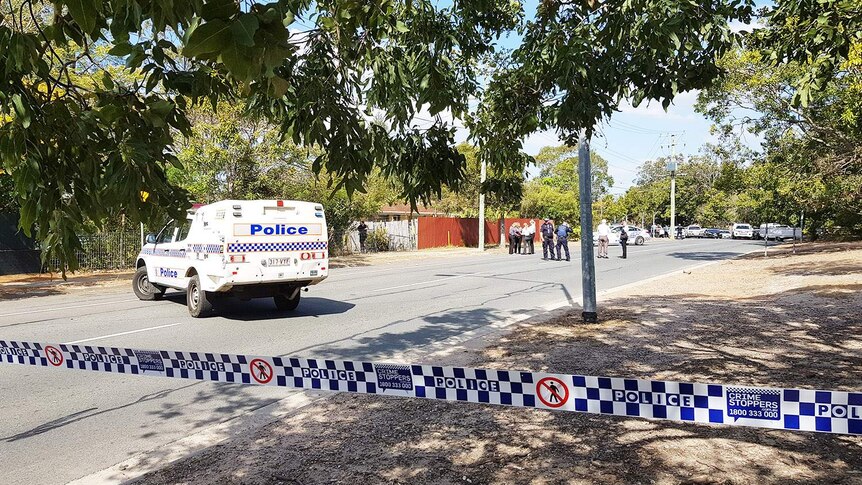Police cars block Station Road at Woodridge, where a72-year-old man was shot by police.