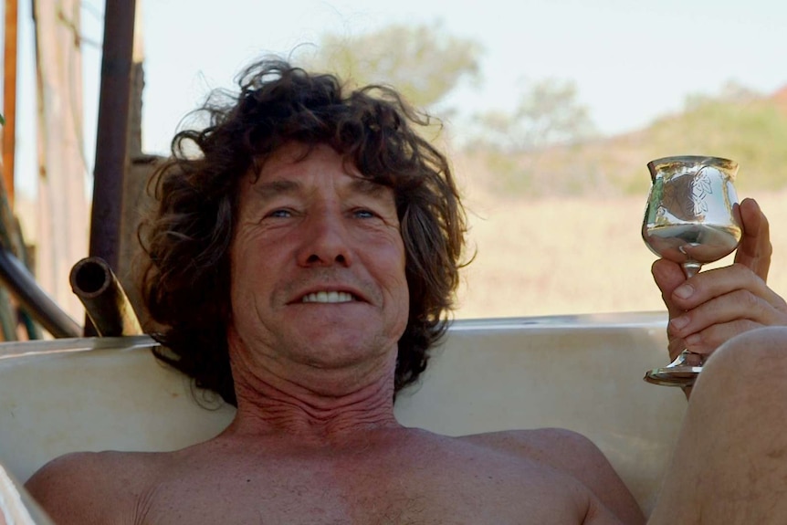 Peter Heyward relaxes in the bath at his home in Wittenoom.