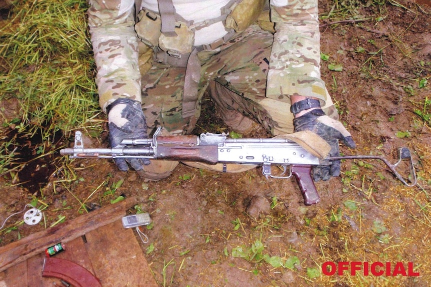 A soldier holding a gun