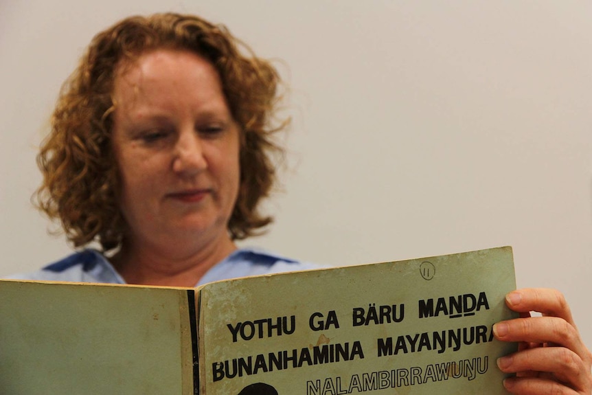 Cathy Bow from the Living Archive of Aboriginal Languages reads a book from the island community of Milingimbi.