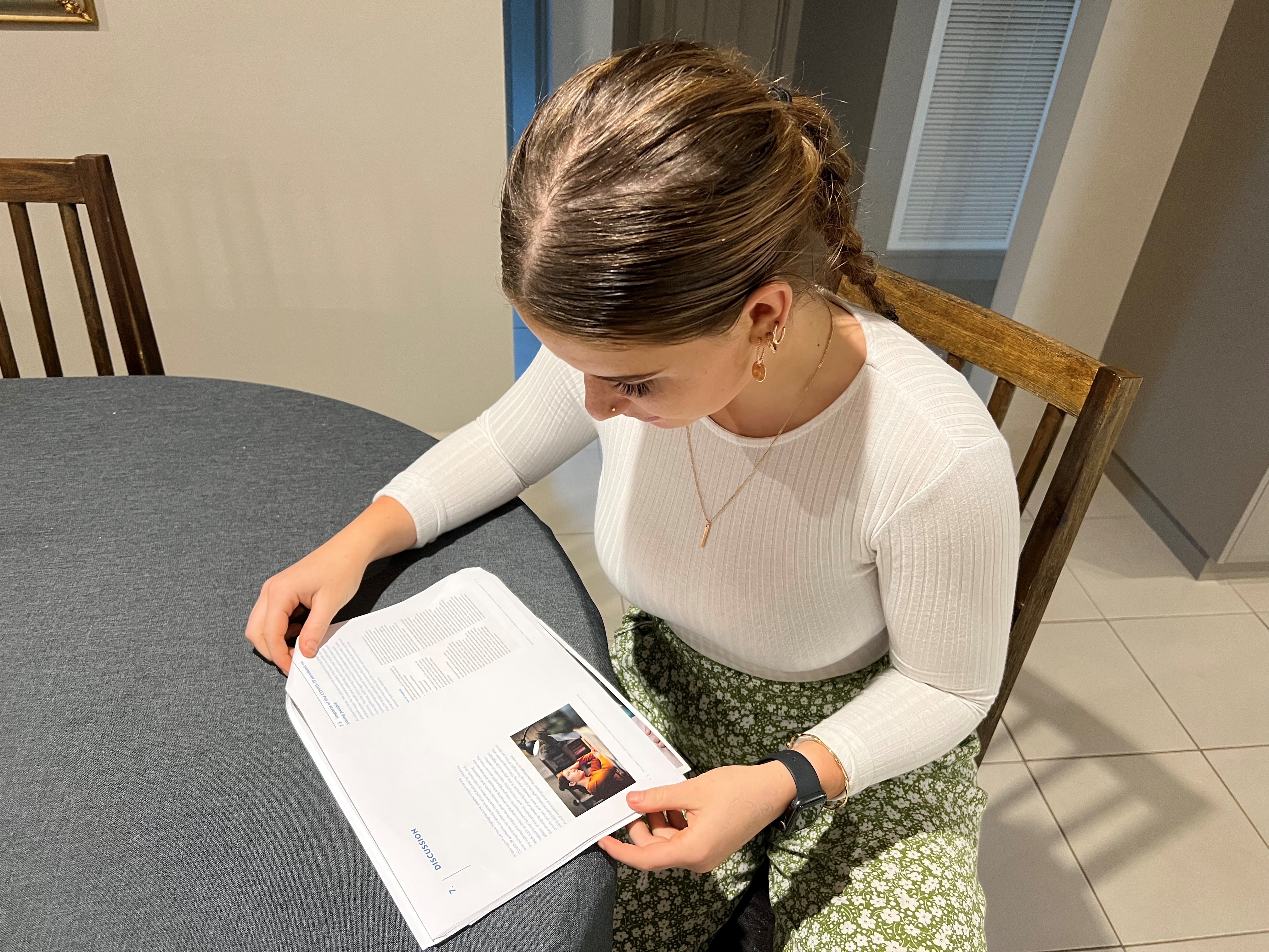 Millie reading the Orygen report