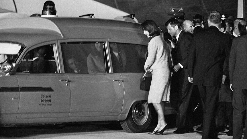 Jacqueline Kennedy and Robert Kennedy get into the Navy ambulance carrying the body of JFK.