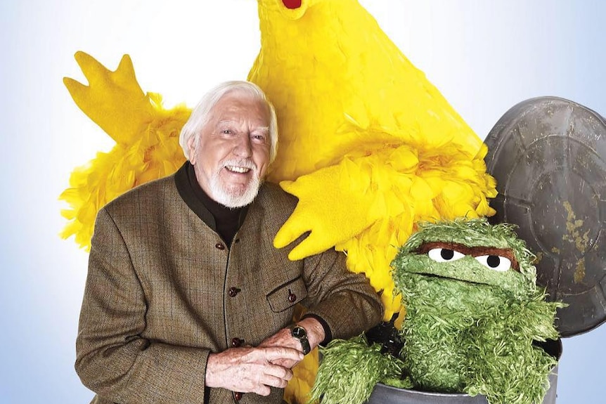 Caroll Spinney with his characters
