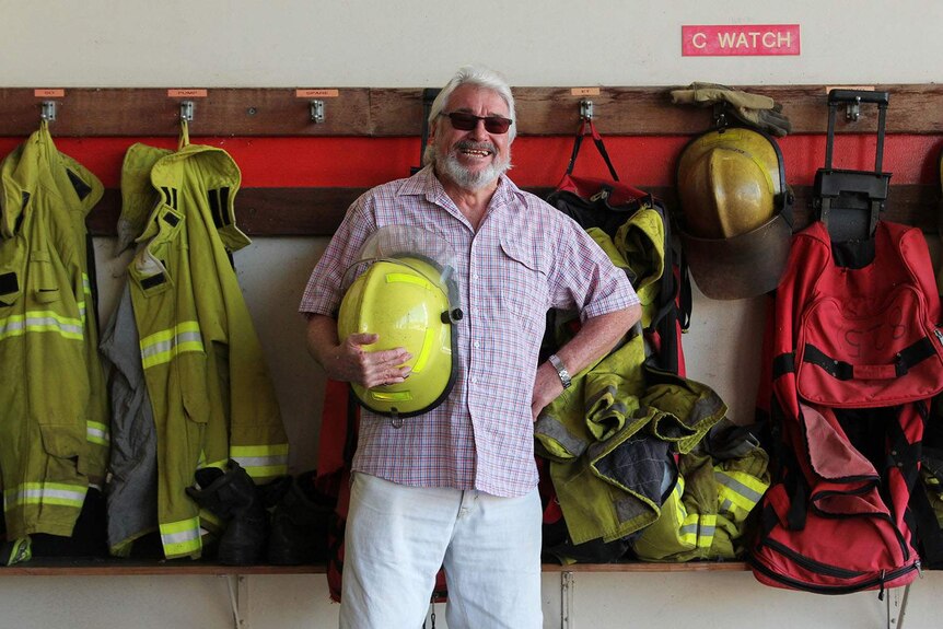 a man standing in front of firefighter material