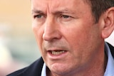 Mark McGowan with a concerned look on his face outside his Rockingham office.