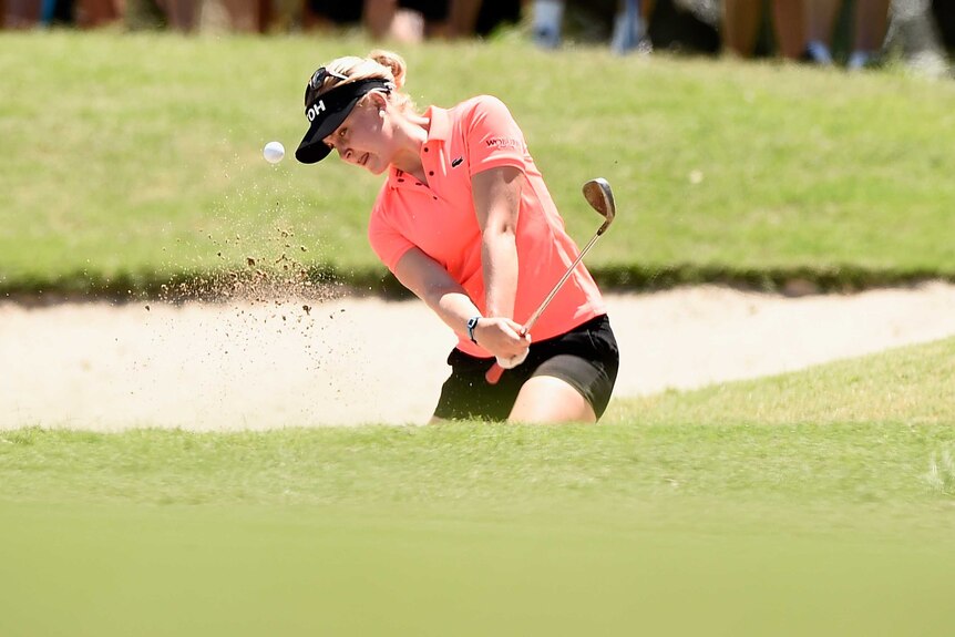 Share of the lead ... Charley Hull hits out of the bunker