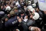 Police officers scuffle with angry lawyers during a clash in Lahore, Pakistan.