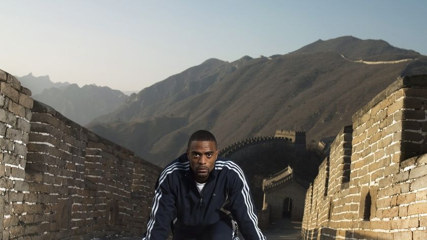 Tyson Gay poses on the Great Wall