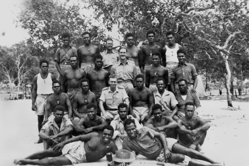 black and white photo of group of Indigenous and non-Indigenous soldiers