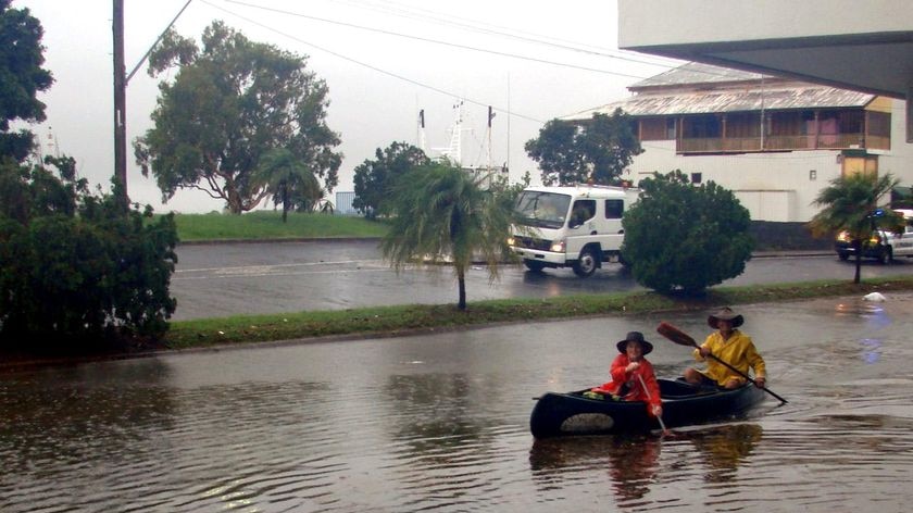 Two Mackay residents paddle down River Street
