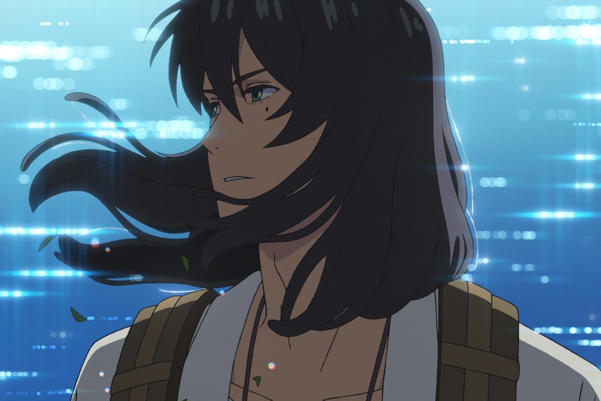 A still from an anime movie, where a young man, with shaggy shoulder-length hair looks determined, his face turned to the side.