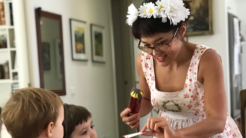 Yumi Stynes with two young children in a home on Christmas Day.